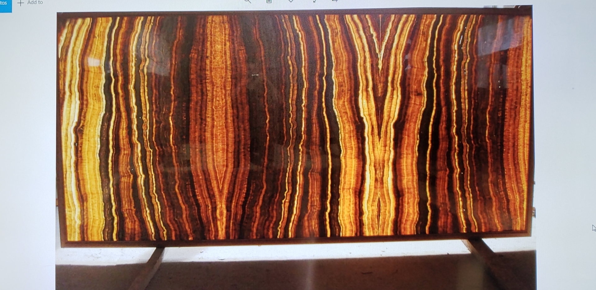 The same bookmatched wooden onyx, backlit